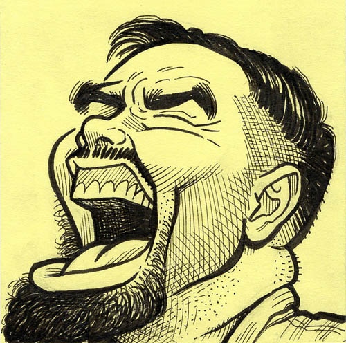 Man with beard laughing hard